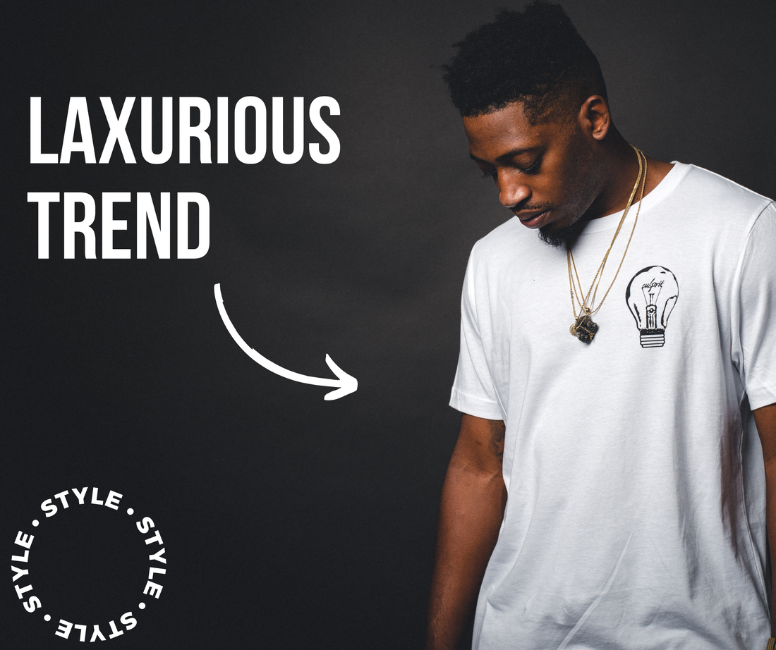 Stylish man wearing a premium white T-shirt paired with tailored blazer, showcasing luxury casual fashion by Mebrand