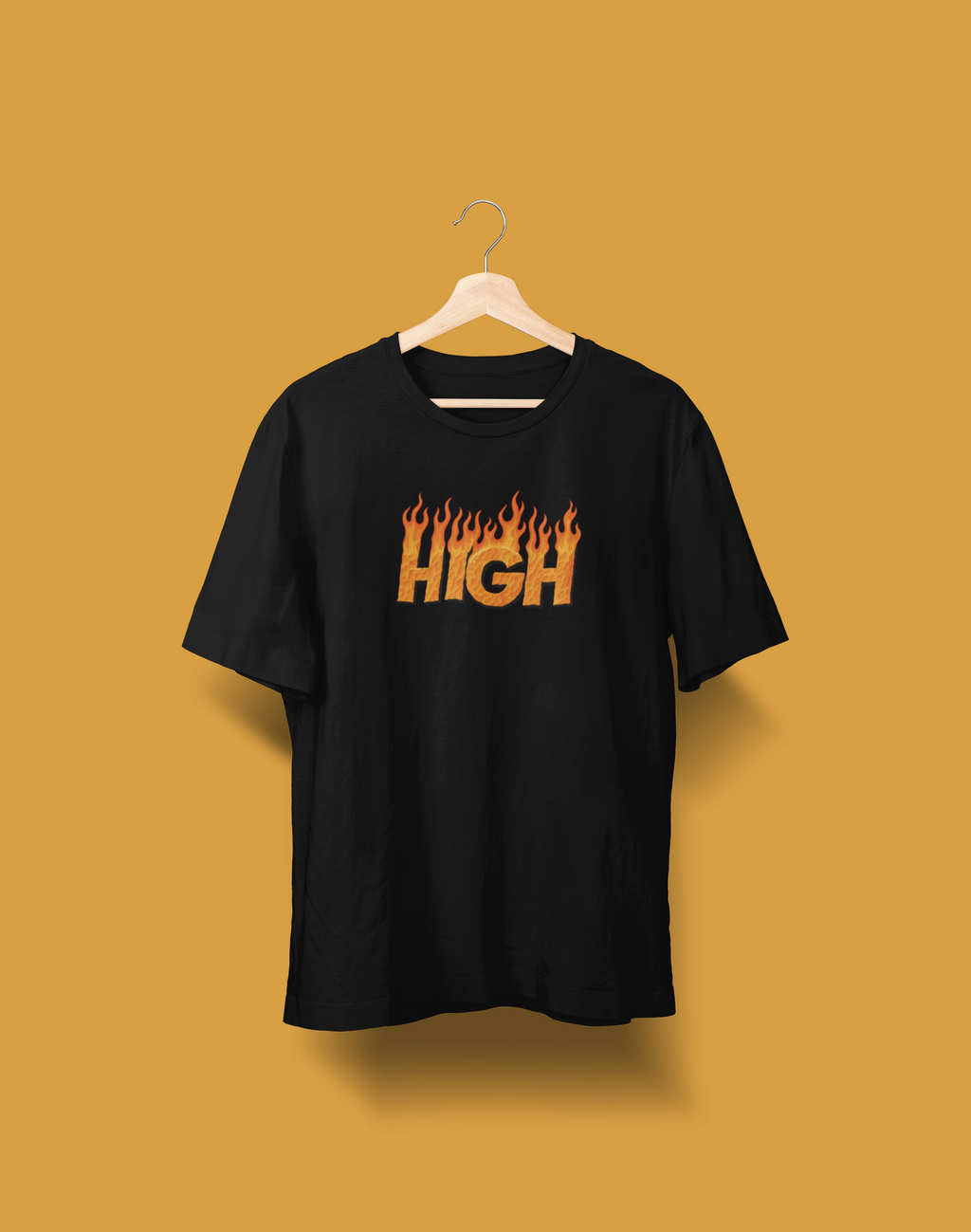 Man wearing a black 240 GSM oversized t-shirt with flame-text "HIGH" graphic, sitting on a bench in front of a yellow car.