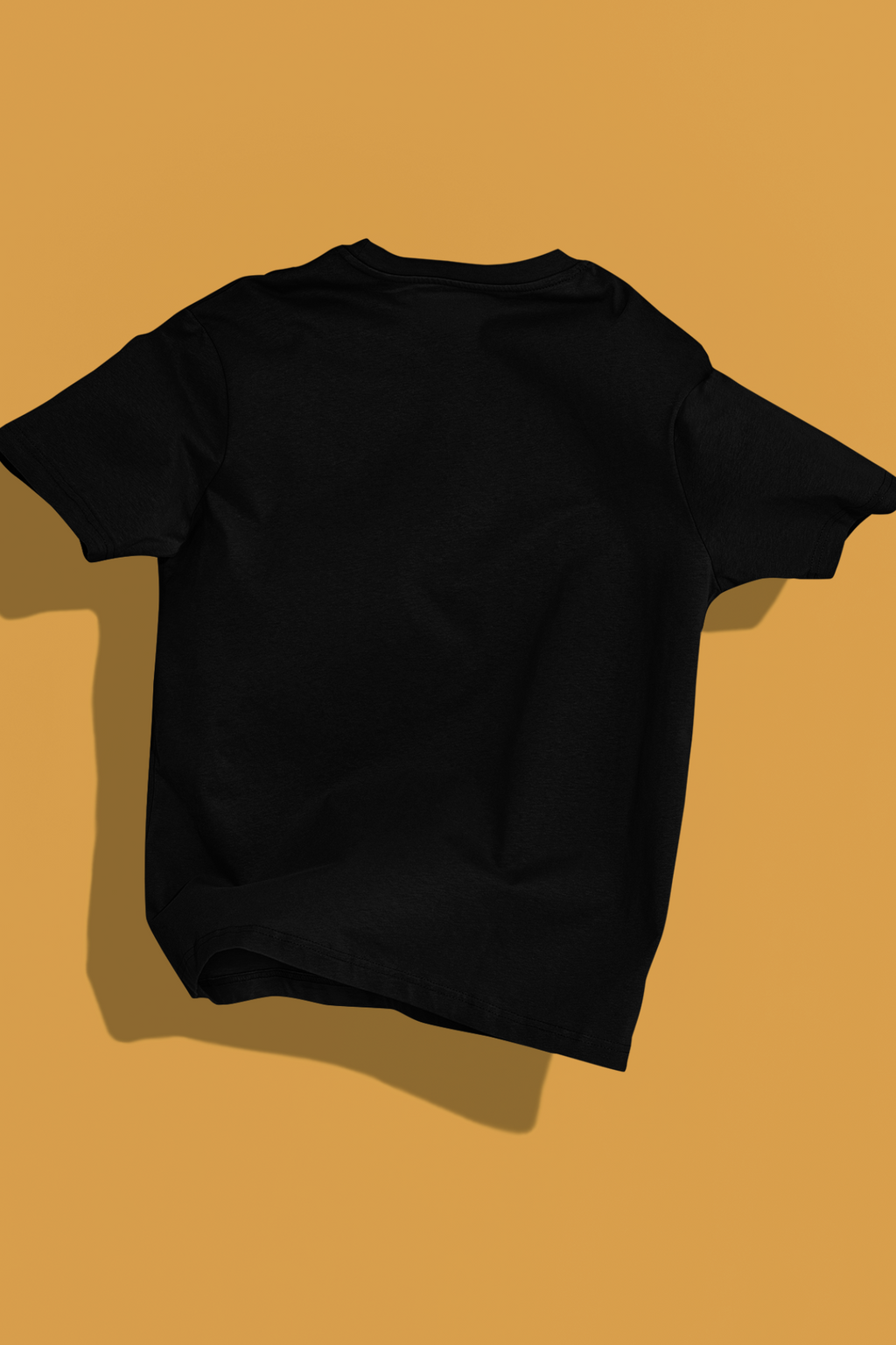 Man wearing a black 240 GSM oversized t-shirt with flame-text "HIGH" graphic, sitting on a bench in front of a yellow car.