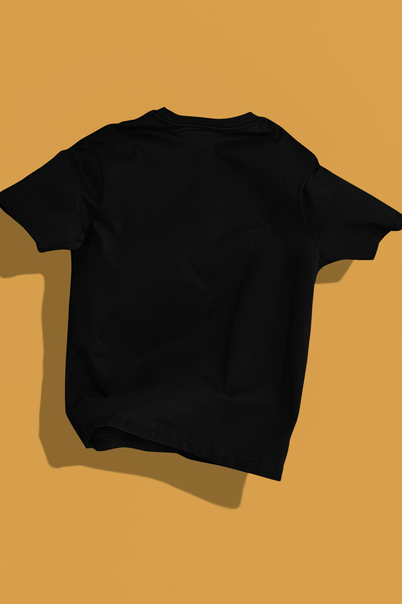 Man wearing a black 240 GSM oversized t-shirt with flame-text "HIGH" graphic, sitting on a bench in front of a yellow car.